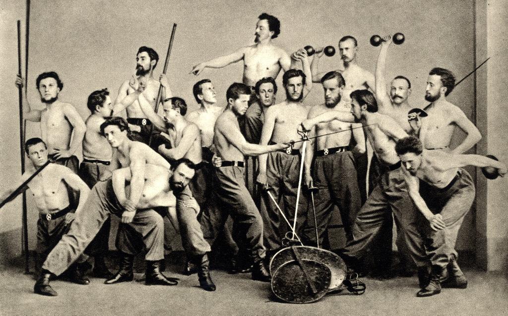 Skupinový portrét cvičitelů Sokola Pražského roku 1864 v čele s Dr. M. Tyršem